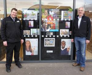 The display board with Ian the store manager and President Jim Hettrick